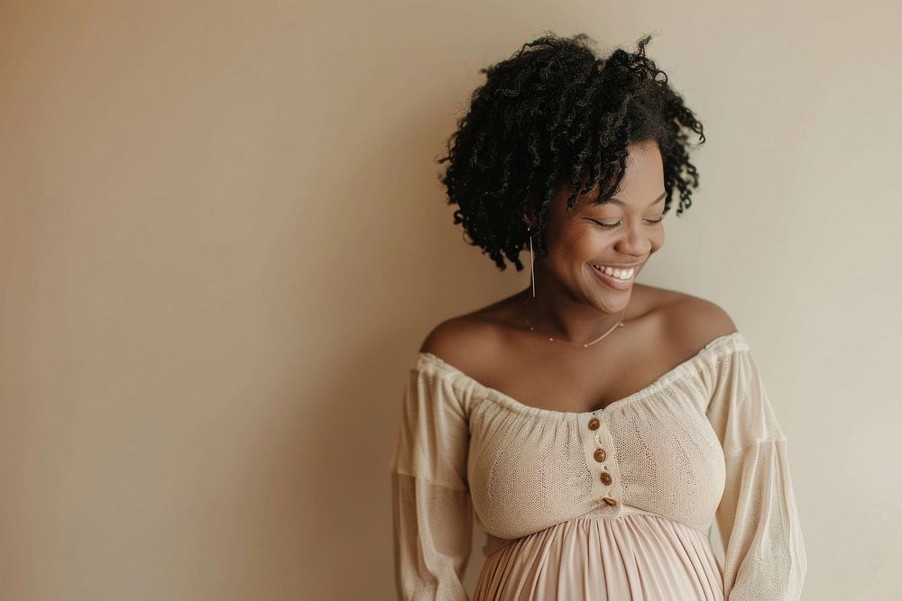 Pregnant black woman smiling adult smile.