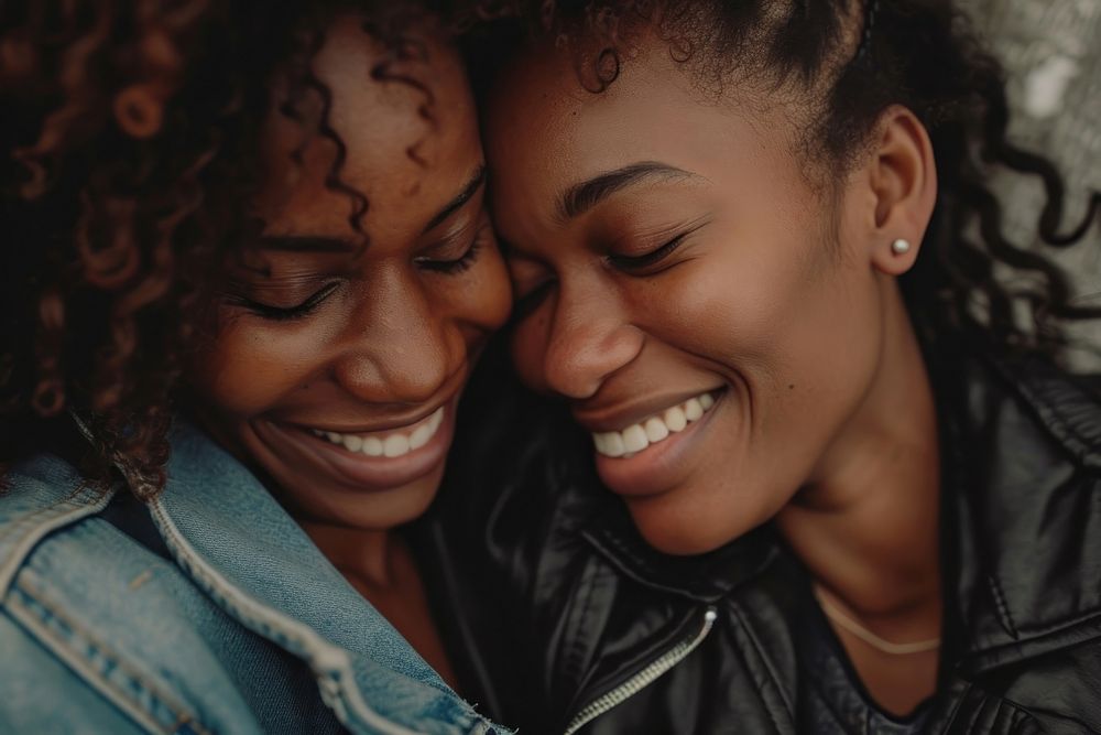 Black lesbian couple smiling laughing portrait smile.