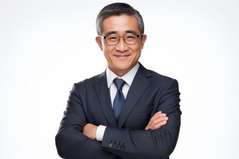 Good-looking middle-aged asian businessman with arms crossed portrait adult smile.