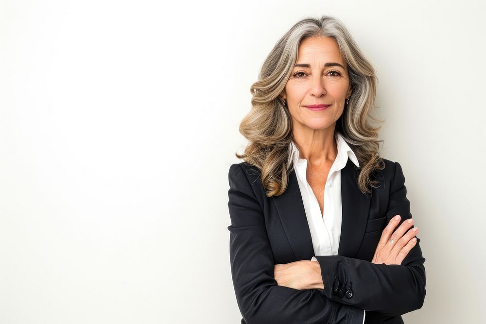 Good-looking middle-aged businesswoman with arms crossed portrait adult photo.
