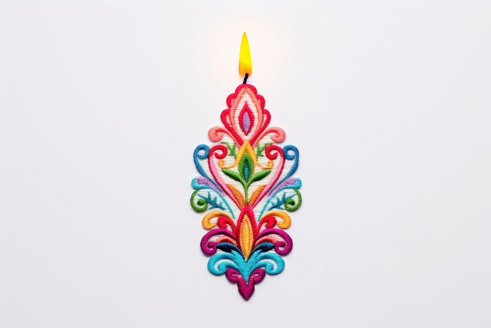 Colorful candle in embroidery style pattern art illuminated.
