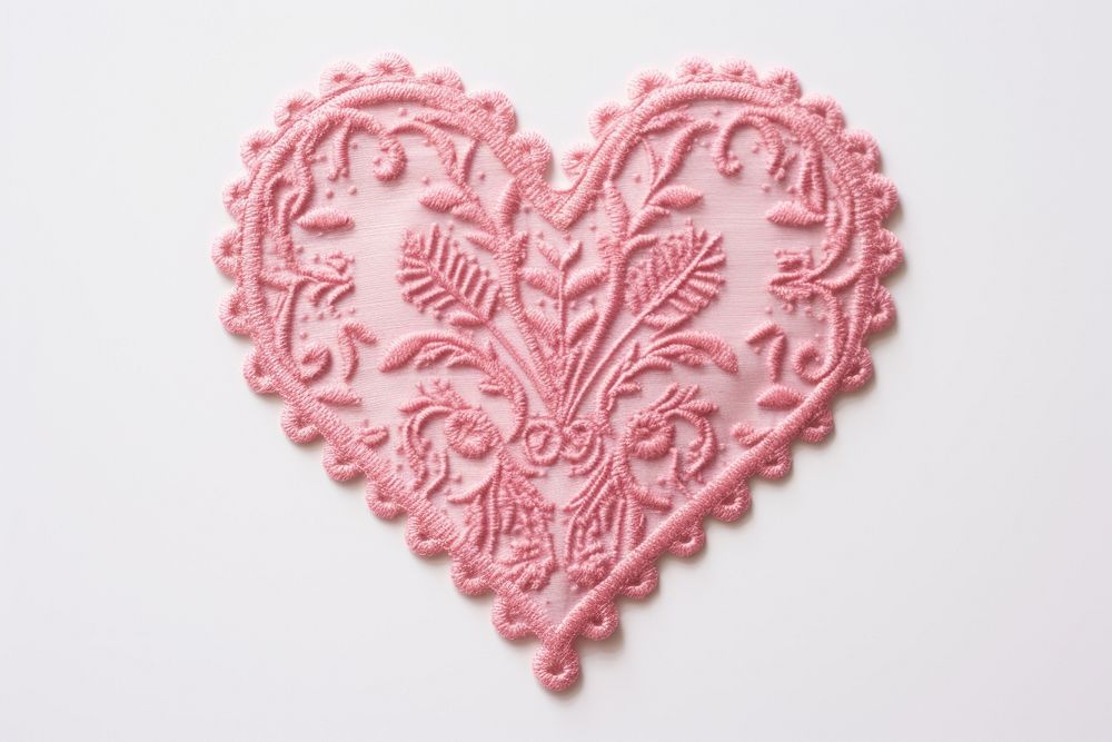 Pink heart in embroidery style pattern representation celebration.