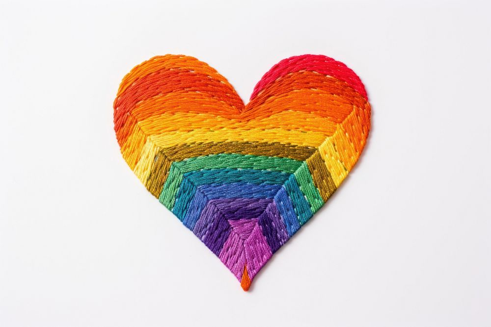 Rainbow heart in embroidery style celebration creativity textile.