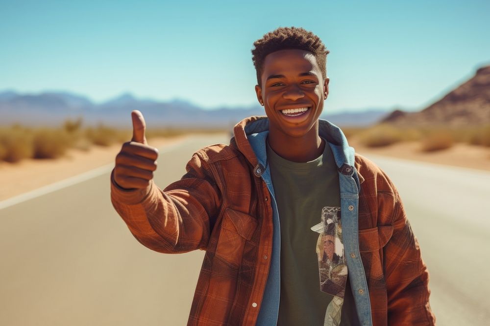 African American teen man travel desert smile.