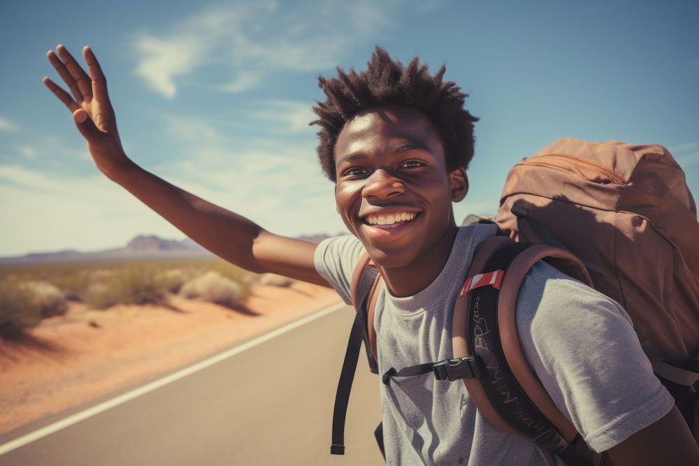 African American teen man portrait backpack outdoors.