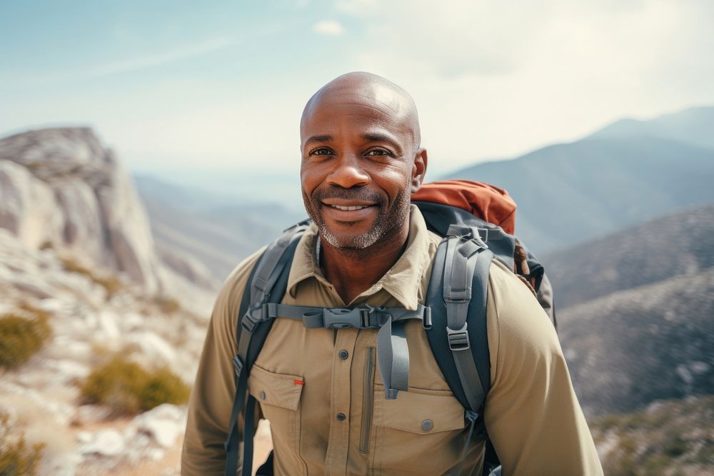 Middle-aged male African American backpacker backpacking photography recreation.