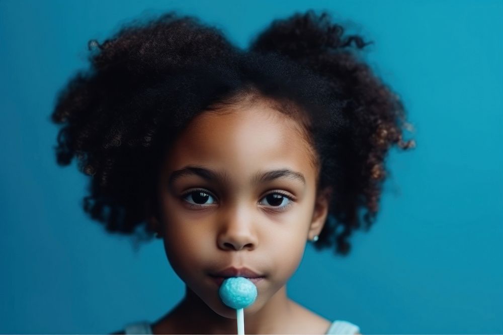 African American girl with lolly child blue food.