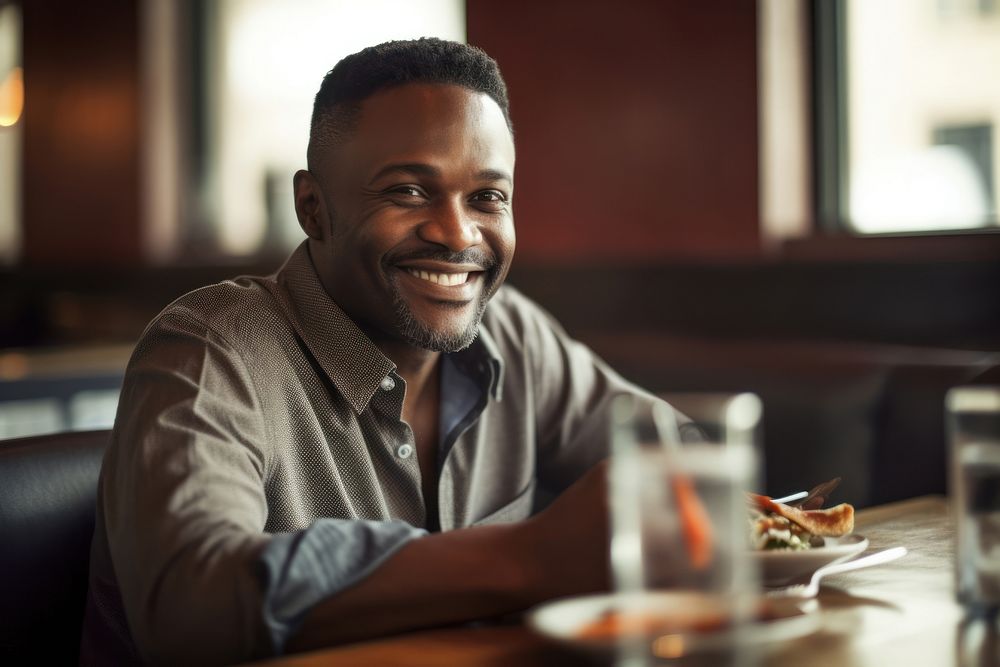 African American man restaurant portrait cheerful.