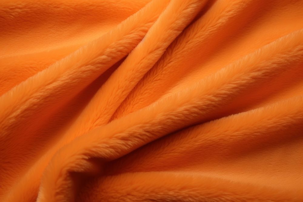Fluffy velvel cloth background backgrounds orange color textured.