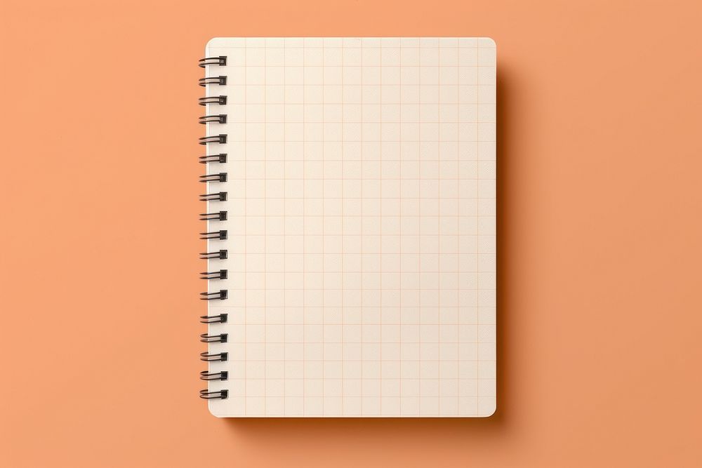 Light orange background with grid pattern paper diary.