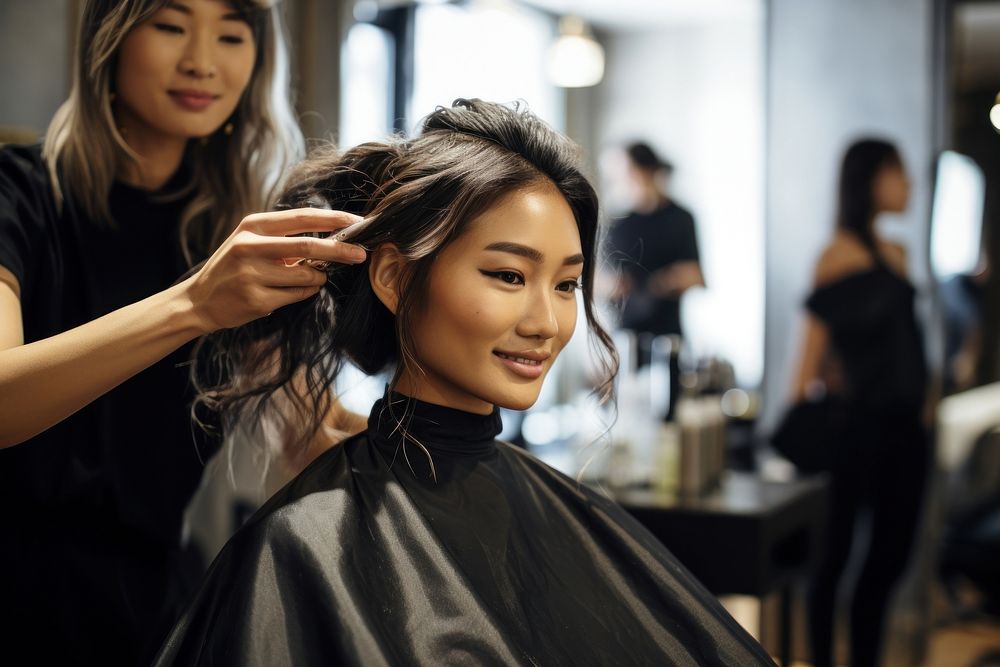 Asian woman getting her hair done adult hairdresser hairstyle.