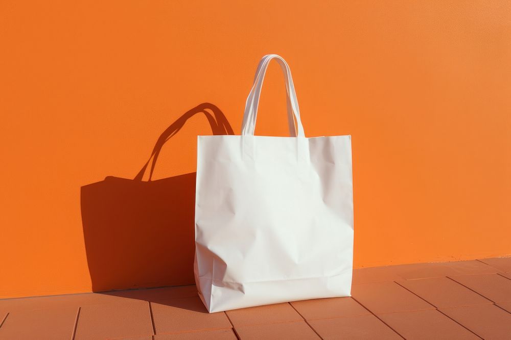 Plastic bag  handbag white orange background.