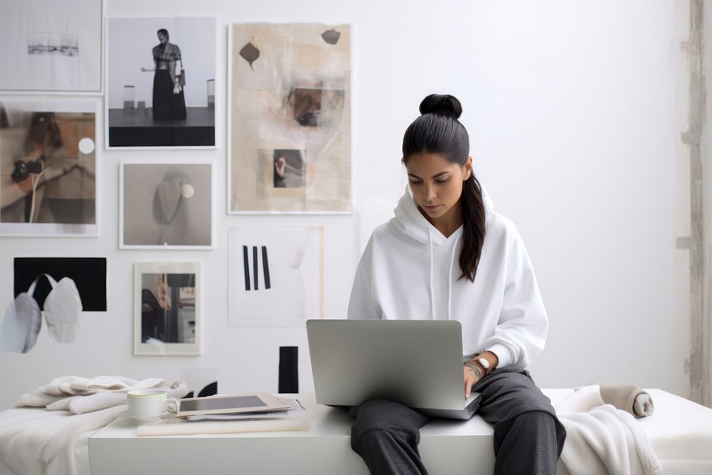 Female fashion studio owner laptop furniture computer.
