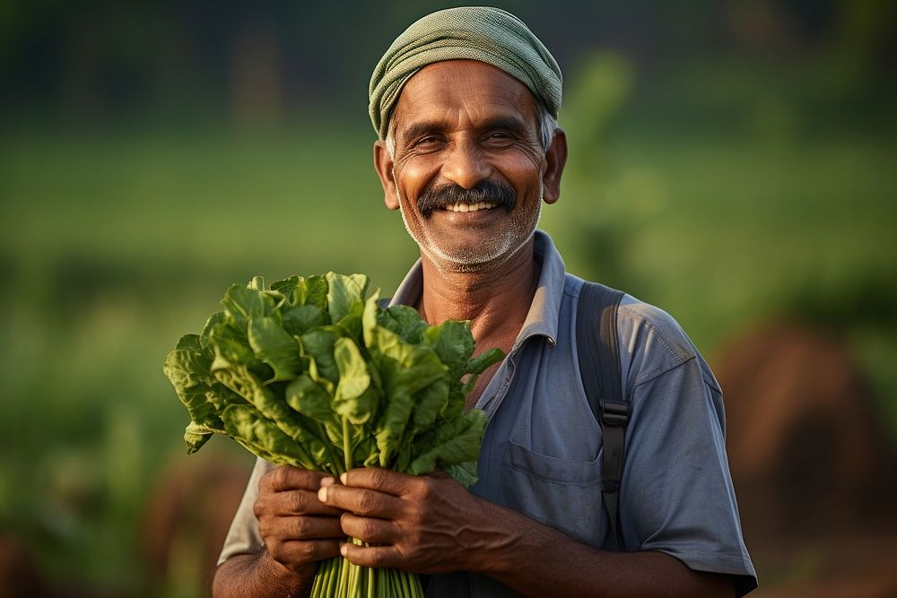 Indian farmer doing agriculture vegetable smiling adult.
