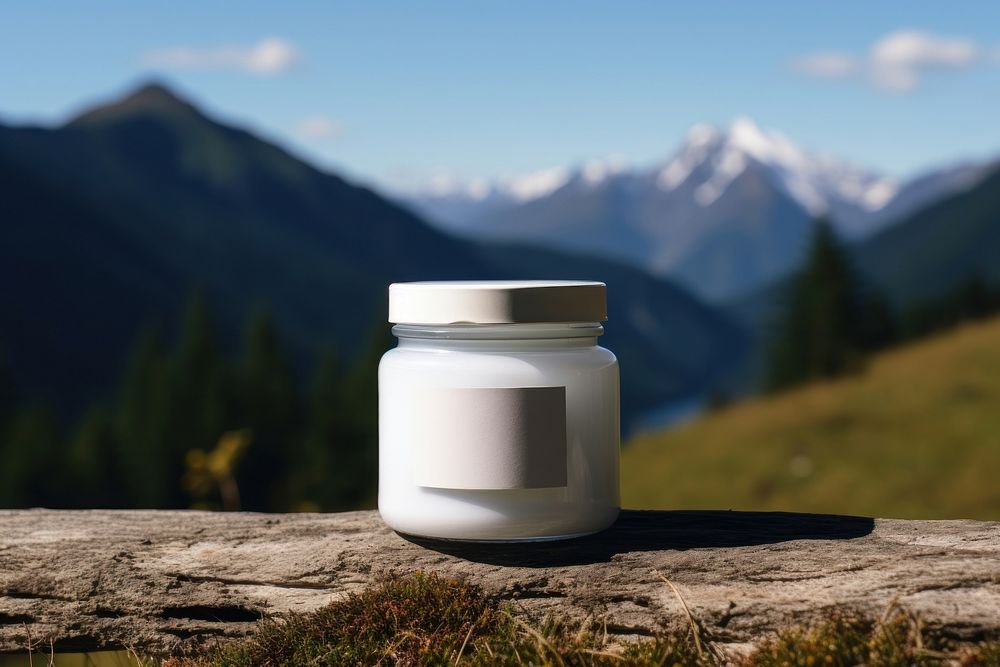 Jar whit label  landscape mountain container.