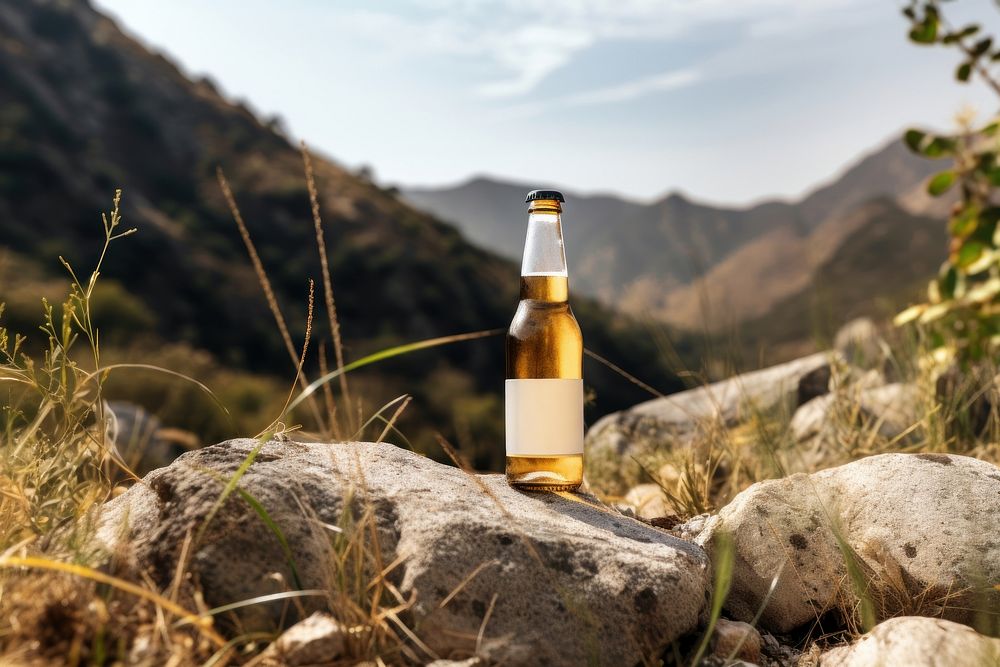 Bottle beer landscape mountain.