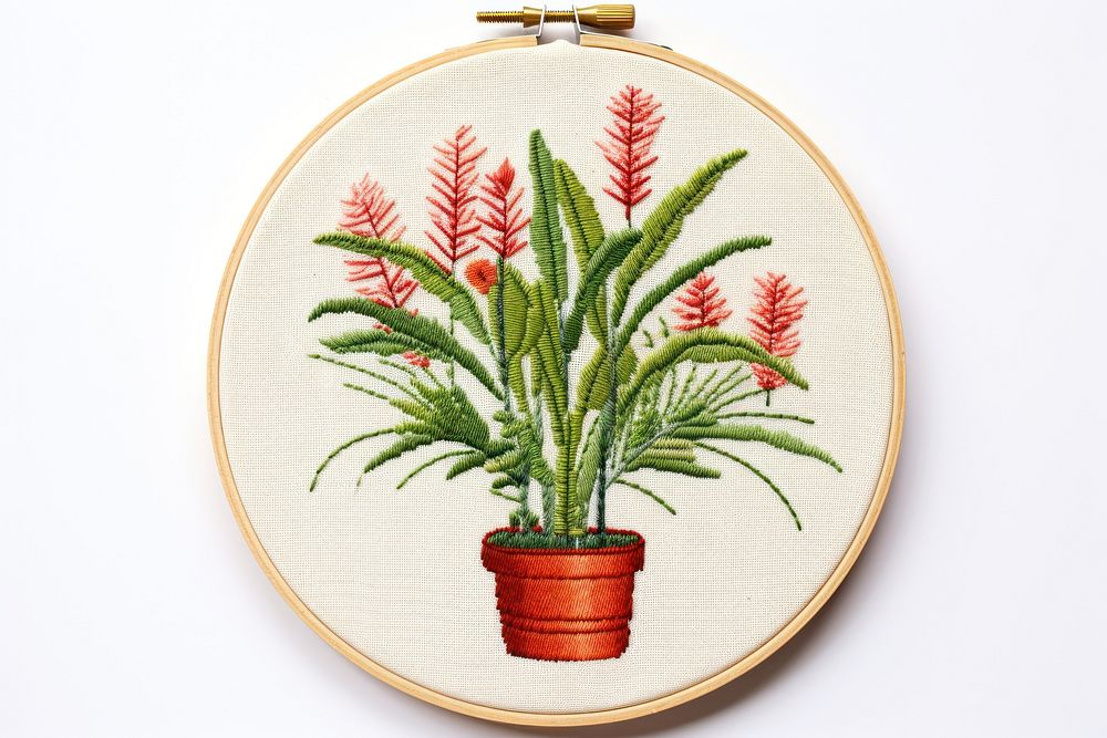 Plant in embroidery style needlework textile pattern.