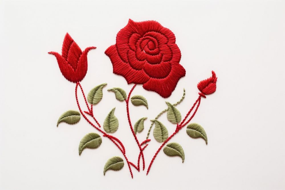 Rose in embroidery style needlework textile pattern.