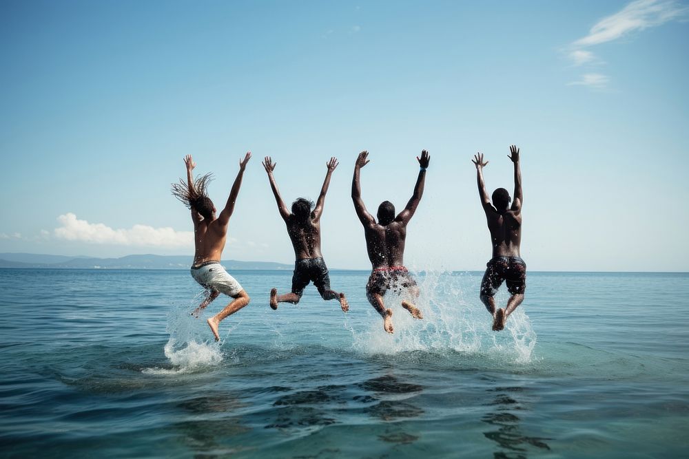 Multiracial friends jumping swimming vacation.