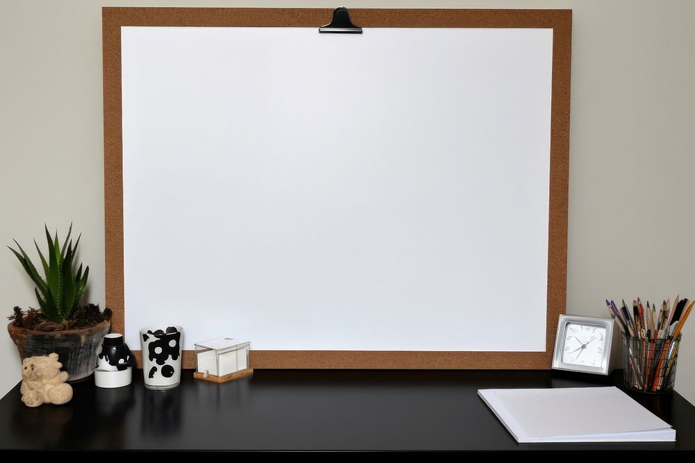 Cork board with white polaroid furniture absence frame.