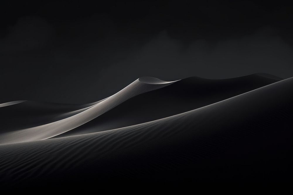 Dark background dune sand monochrome.