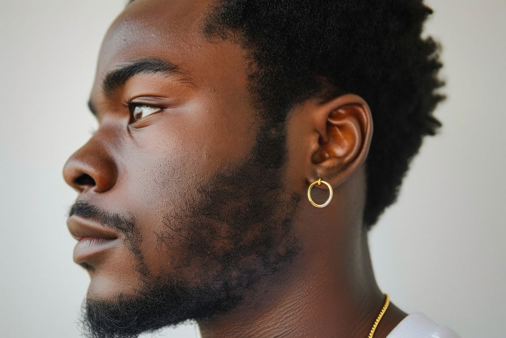 Close-up photo of a man earring jewelry adult.