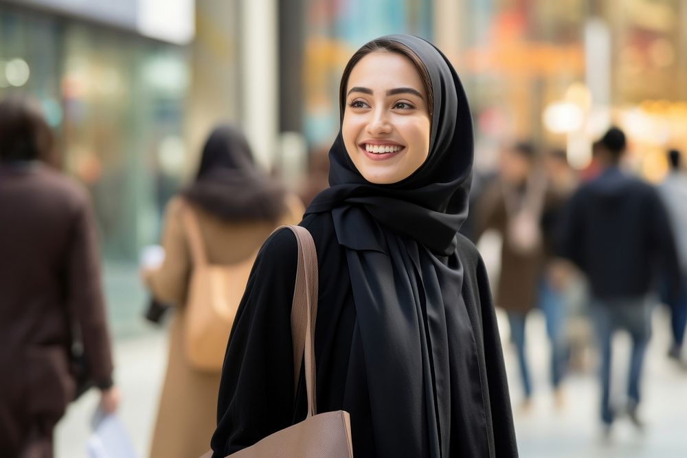 A happy Middle east woman with shopping bags street adult smile.