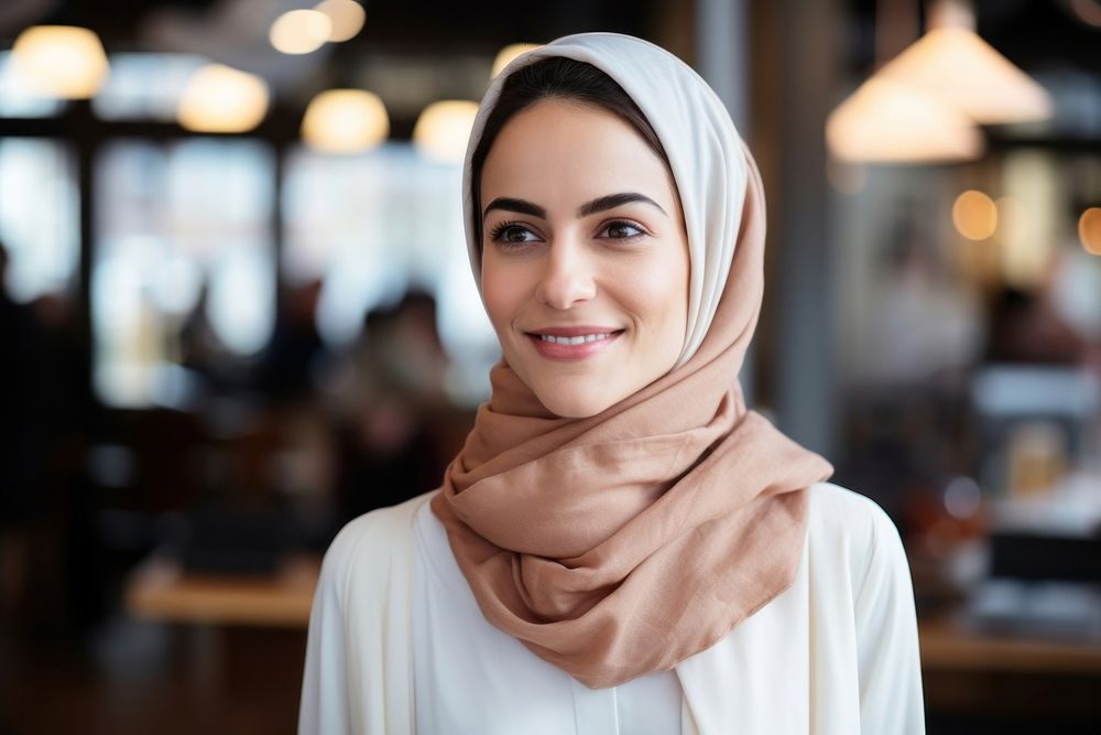 A happy Middle east woman coffee shop owner adult scarf smile.