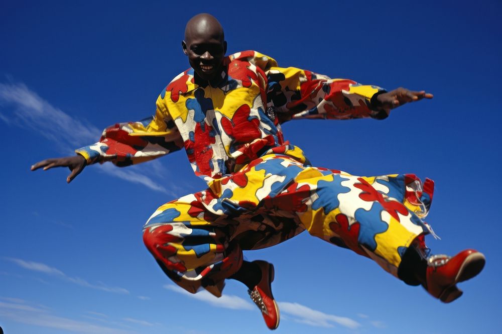 Athletic african man jumping parachuting performance.