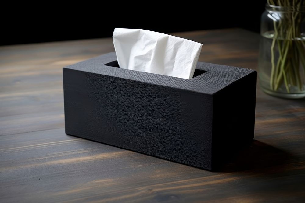 Black tissue box with a black cloth paper electronics simplicity. AI generated Image by rawpixel.