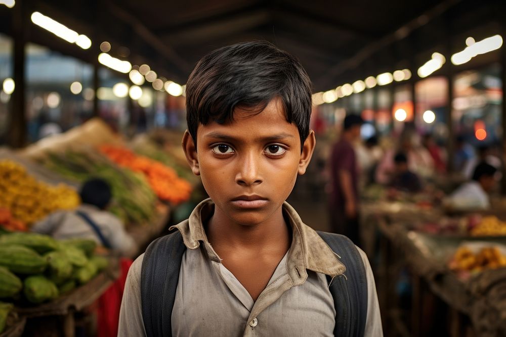 Young South Asian boy market portrait architecture.