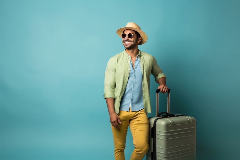South asian man suitcase vacation glasses.