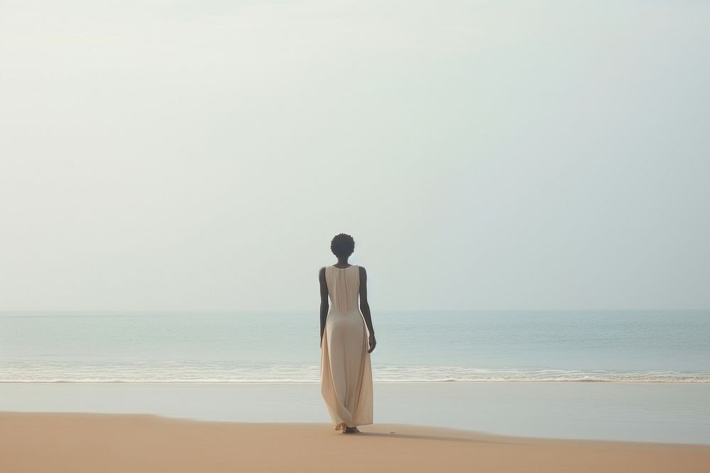 African girl on beach outdoors standing horizon.