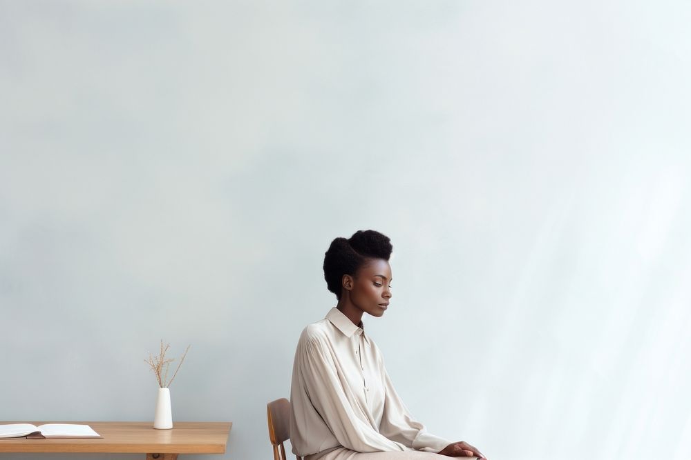 African woman in office sitting adult contemplation.