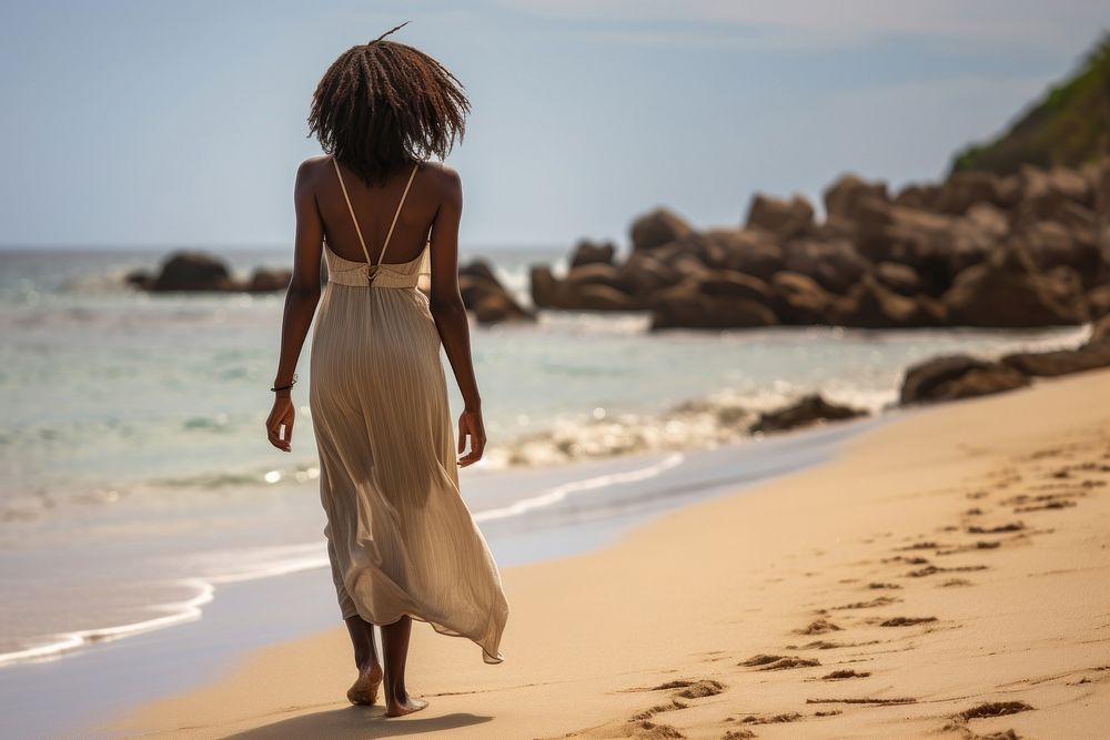 African black woman walking summer beach.