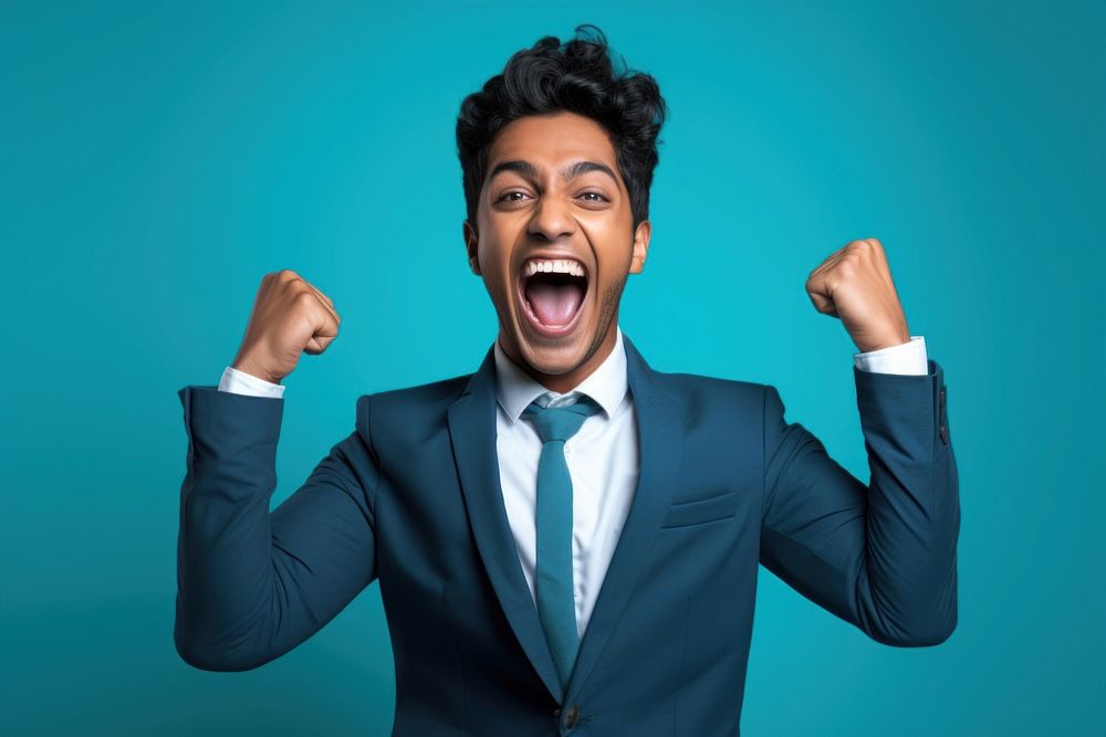 Happy young indian man shouting success adult.