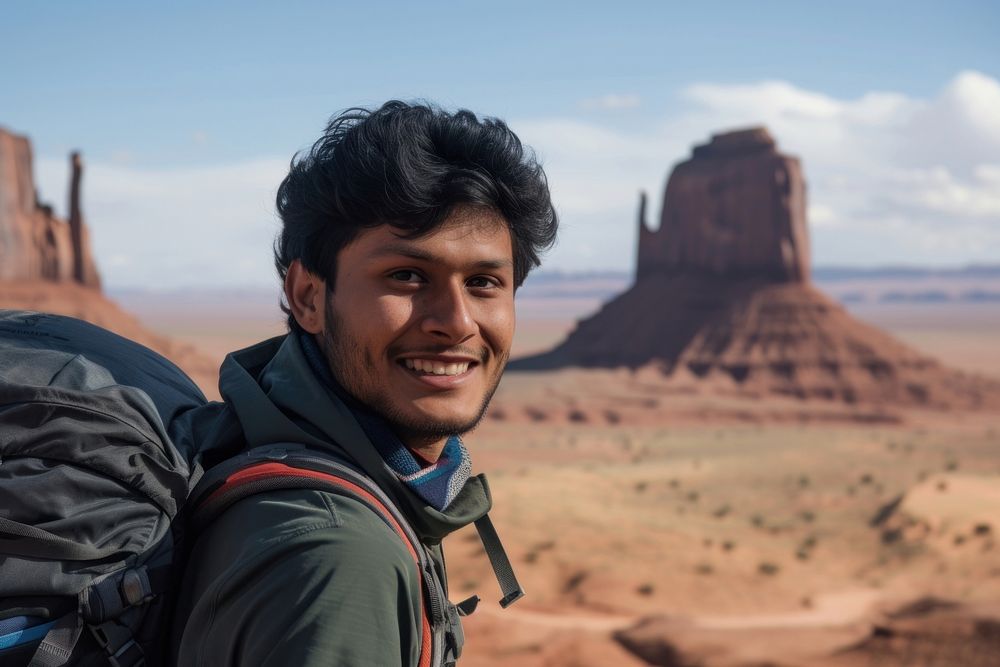 Indian man smiling desert travel.