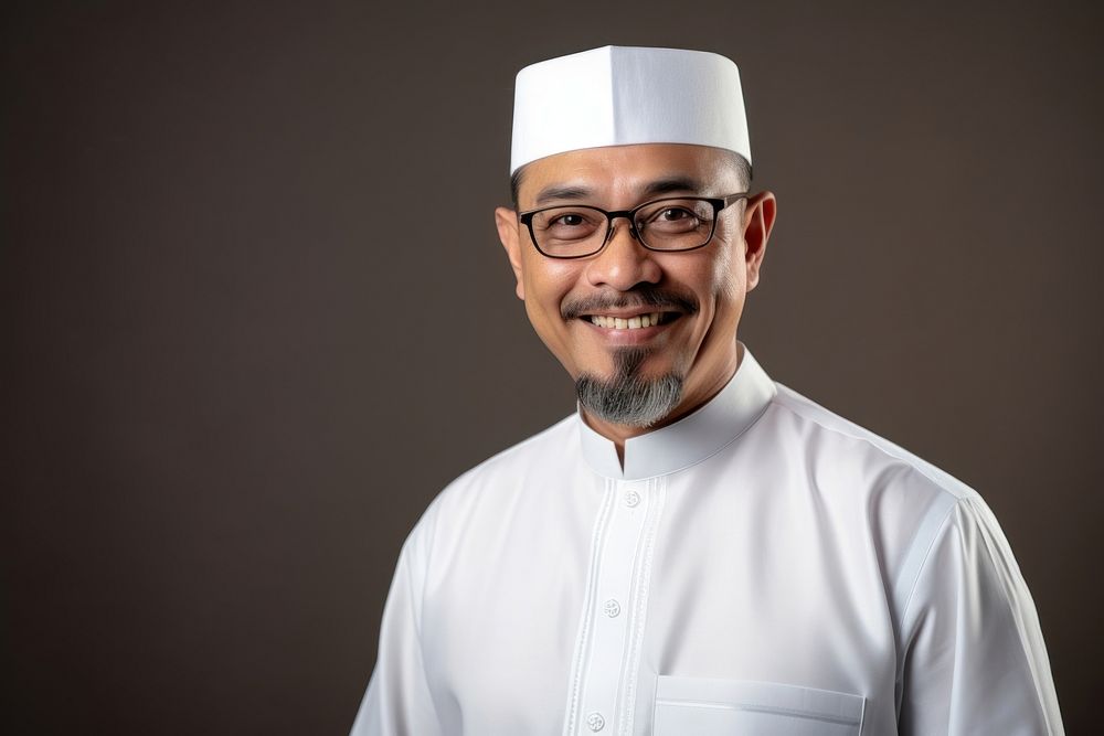 Malaysian glasses smiling adult.