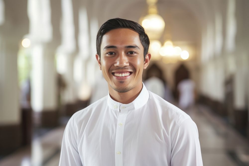Asian Muslim man smiling adult smile.