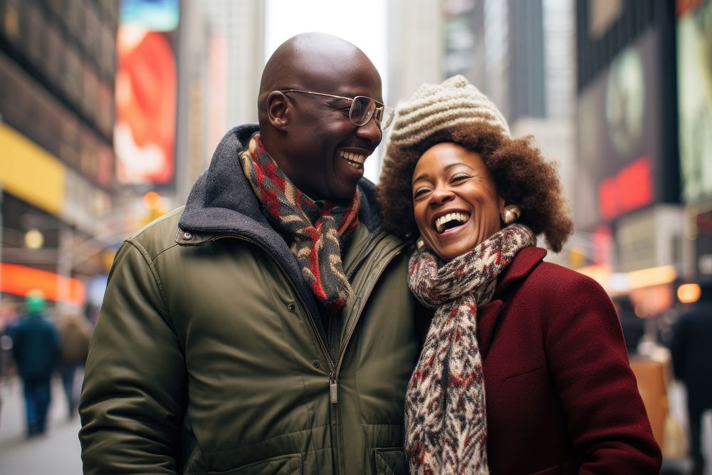 Middle-aged African couple photography laughing portrait.