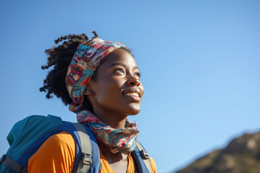 African women hiking backpack looking scarf.
