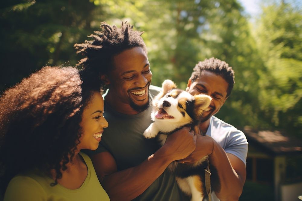 Black family and someone holding puppy outdoors portrait animal.