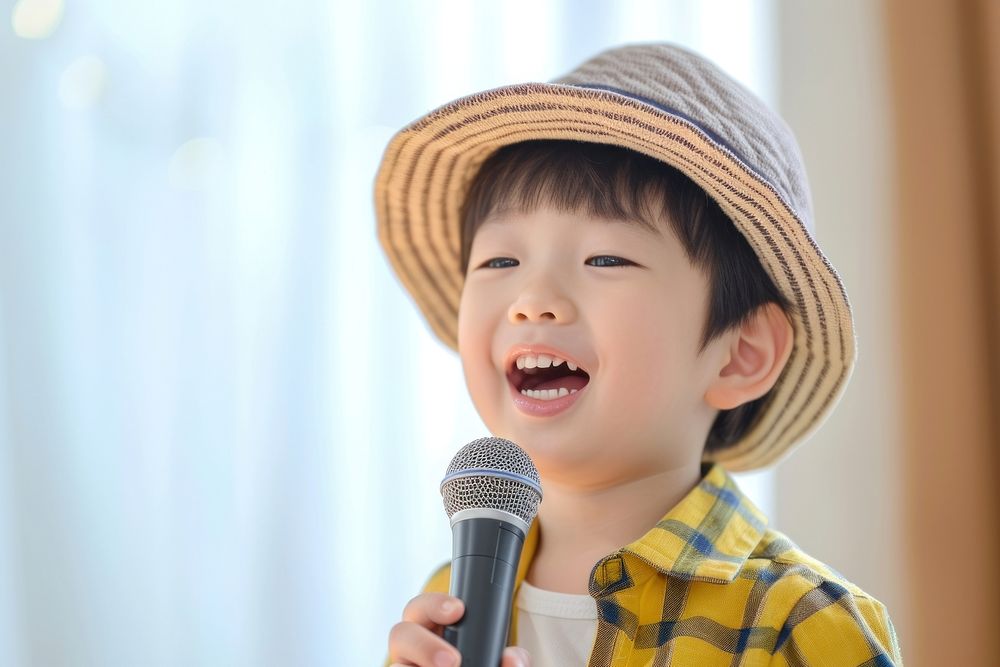 Little singer Korea boy microphone child happy.