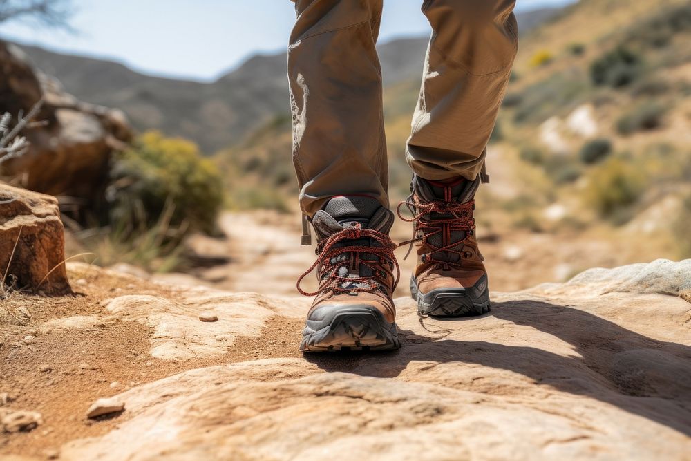 Hiker on a winding trail adventure hiking footwear.