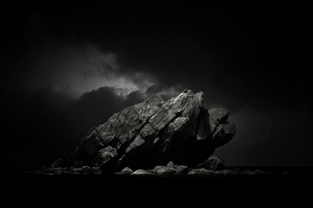 Dark background rock monochrome outdoors.