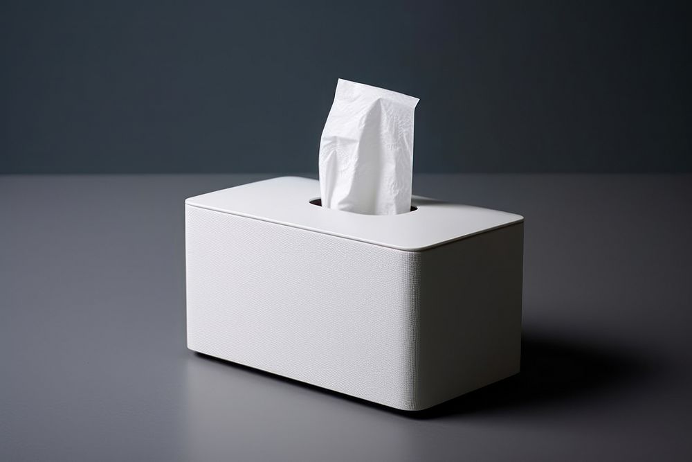 White tissue box with a tin box lighting hygiene paper. AI generated Image by rawpixel.