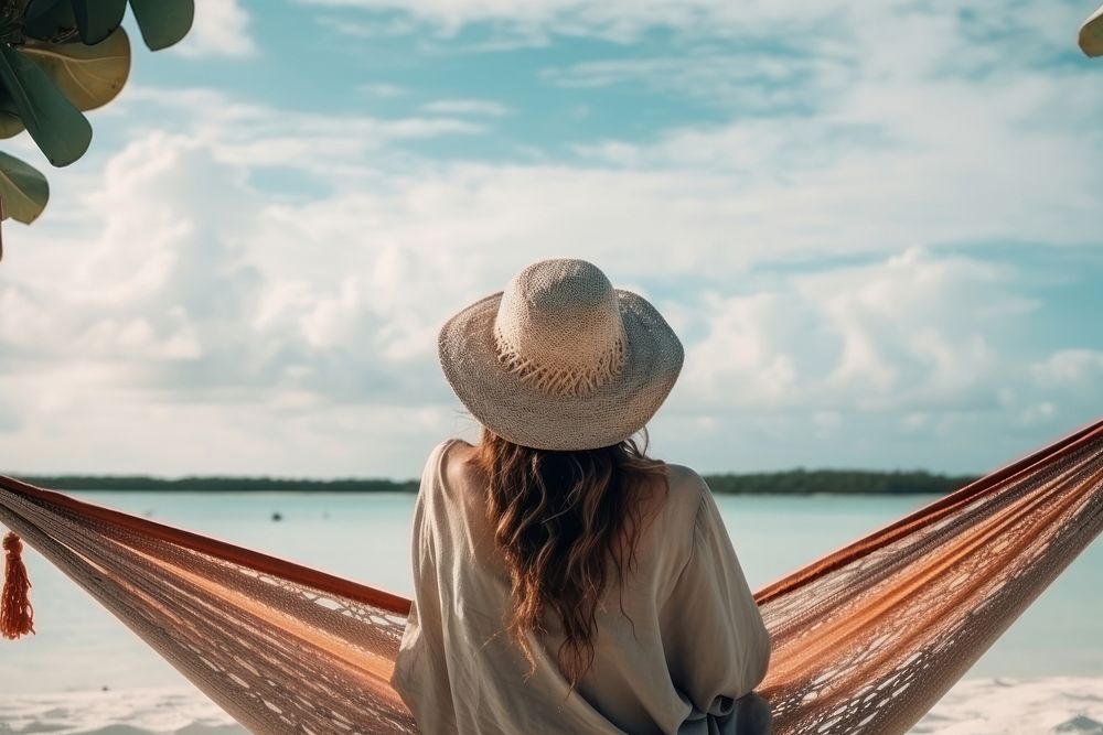 Traveler pacific islander woman vacation outdoors hammock.