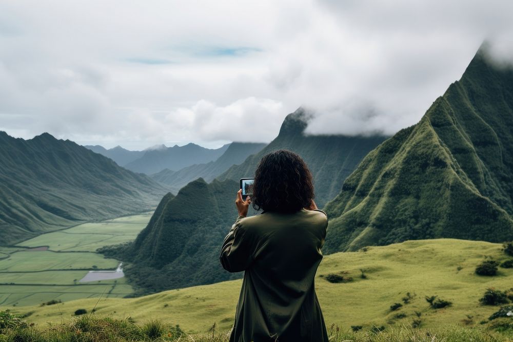 Samoan traveler taking photo landscape mountain outdoors.