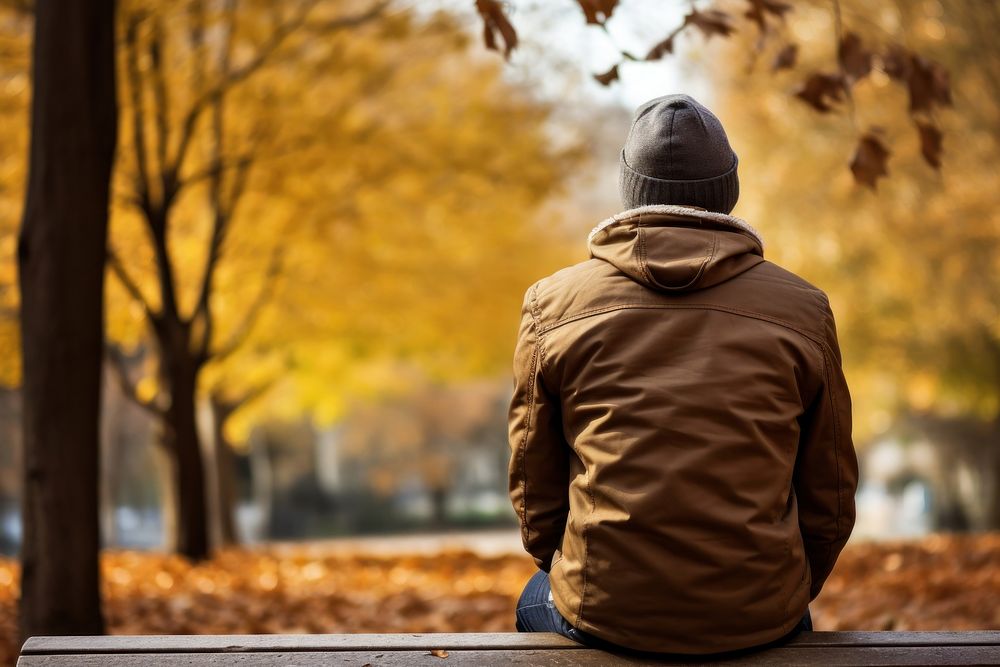 Anxiety sitting autumn bench. AI generated Image by rawpixel.