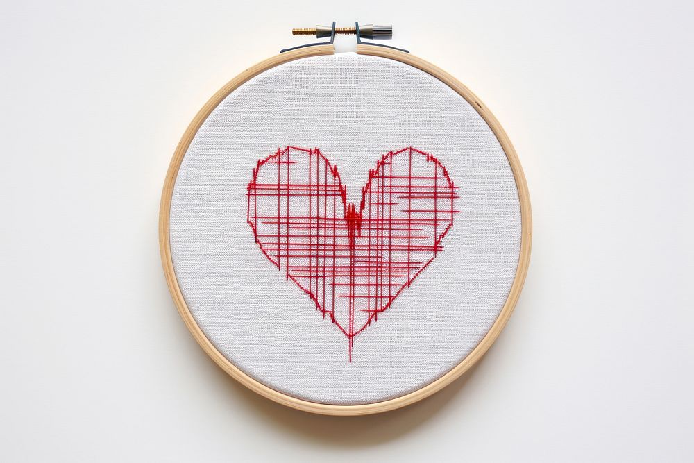 A heart with heart beat EKG graph embroidery pattern creativity.